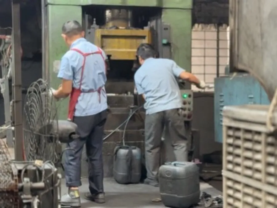 Hot forging press in operation